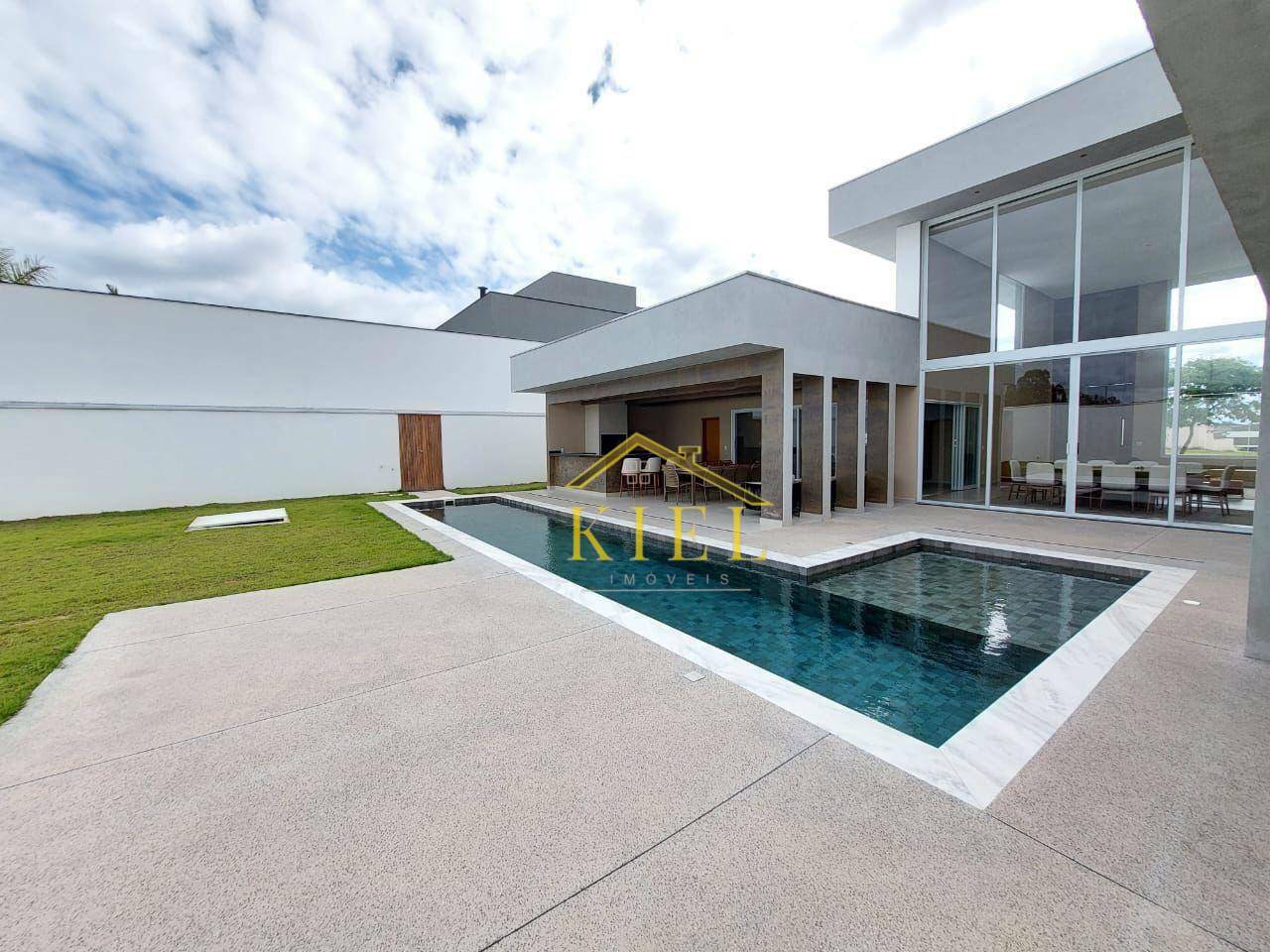 Casa de Condomínio à venda e aluguel com 4 quartos, 394m² - Foto 1