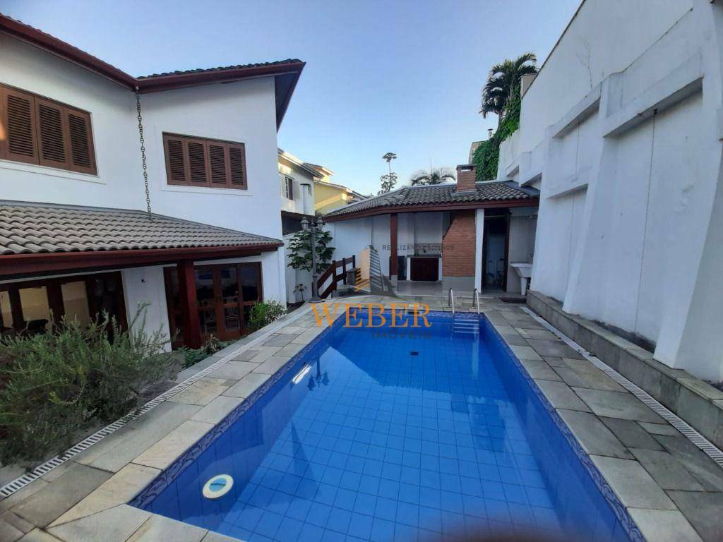 Sobrado à venda com 4 quartos, 316m² - Foto 1